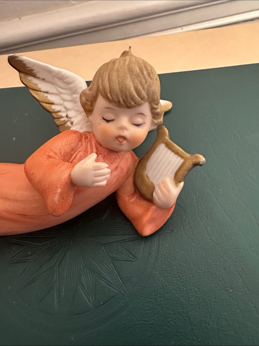 Vintage Christmas Sleeping Angel holding Instrument Made in Taiwan figurine